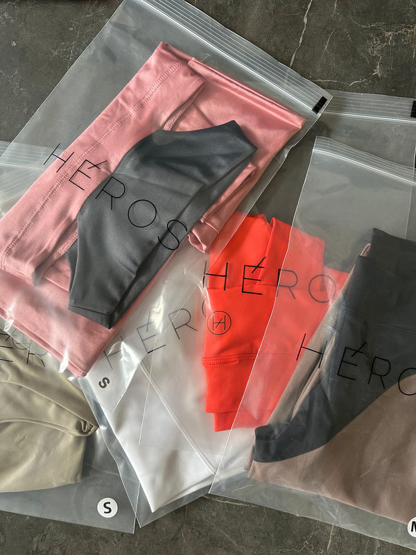 Various pieces in different colors displayed on a surface, with visible branding on them.